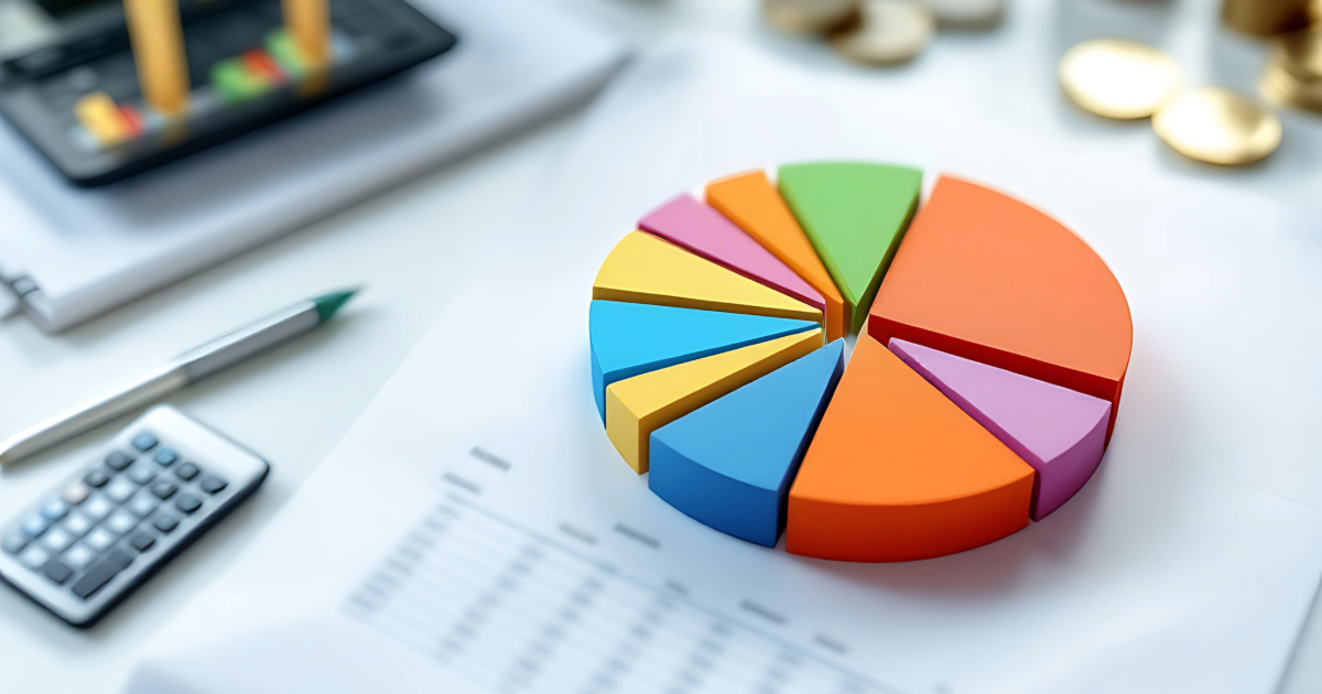 A diversified pie chart overlayed on top of a financial advisor's desk